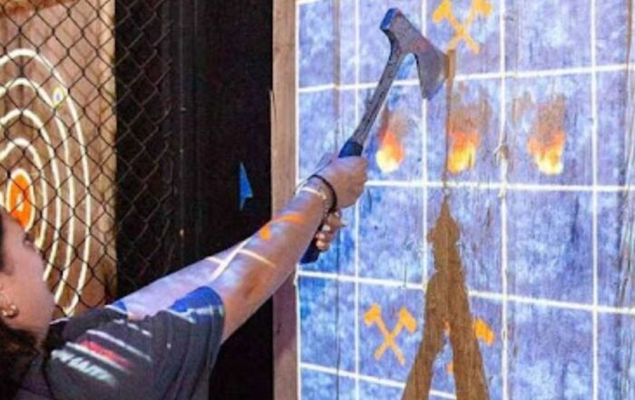 People enjoying an axe throwing party