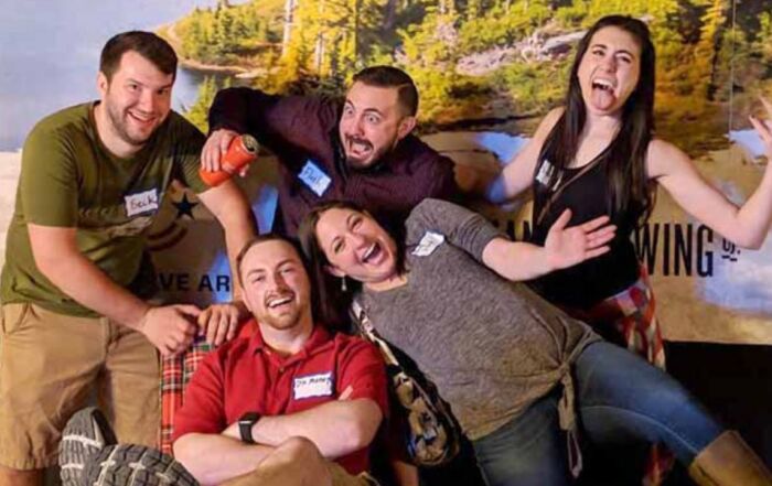 Group of friends posing and laughing together at Montana Nights.