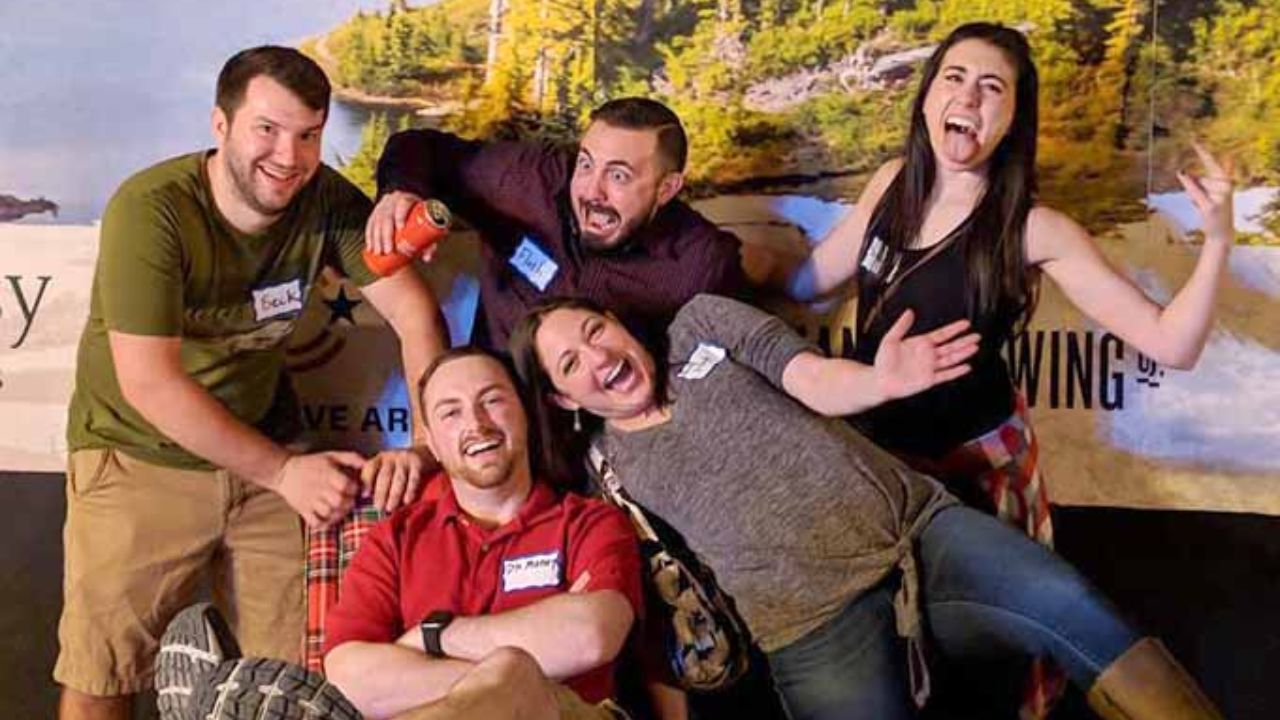 Group of friends posing and laughing together at Montana Nights.