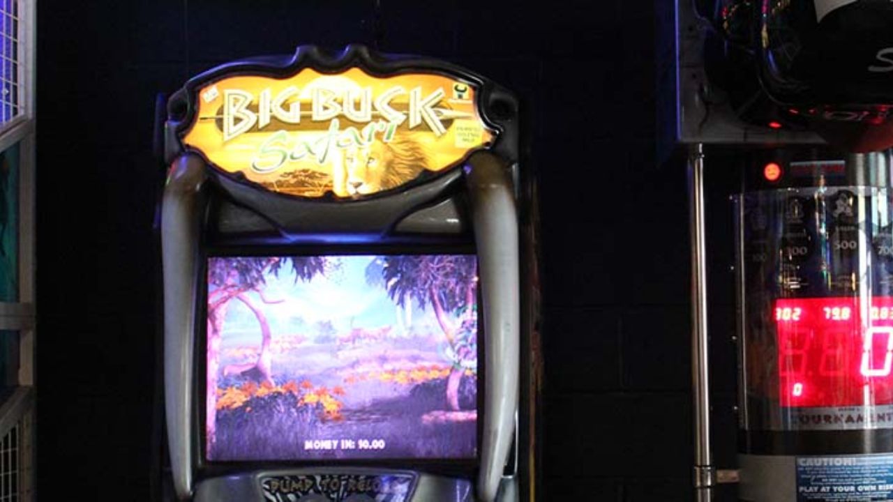 Row of illuminated arcade machines at Montana Nights.