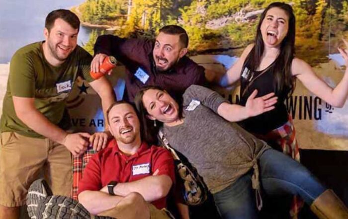 Group of friends posing and laughing together at Montana Nights