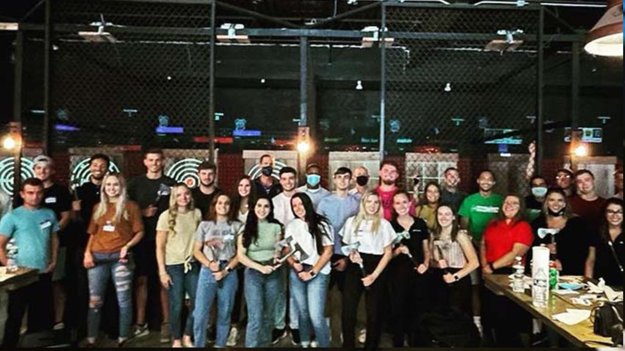 Large group of people standing together inside Montana Nights with multiple lanes