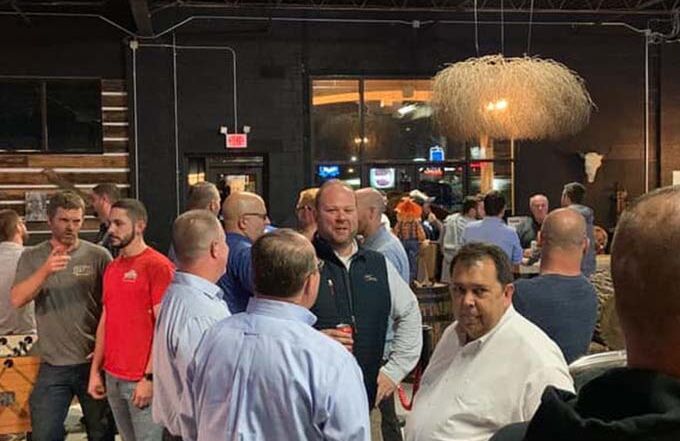 Guests connect and socialize in a lively entertainment space ideal for team gatherings.