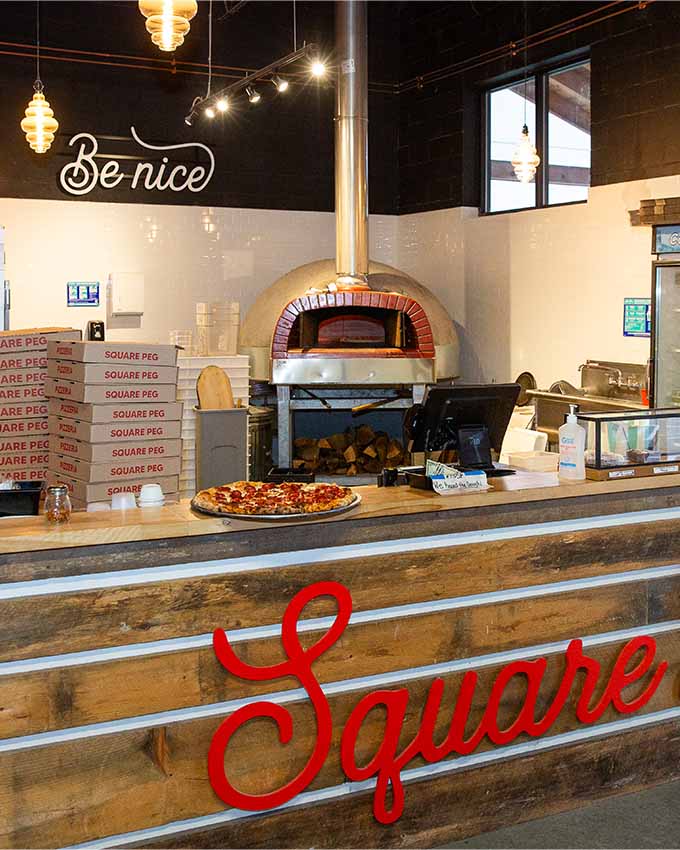 Montana Night Newington’s pizza counter with wood-fired oven inside entertainment and axe throwing venue
