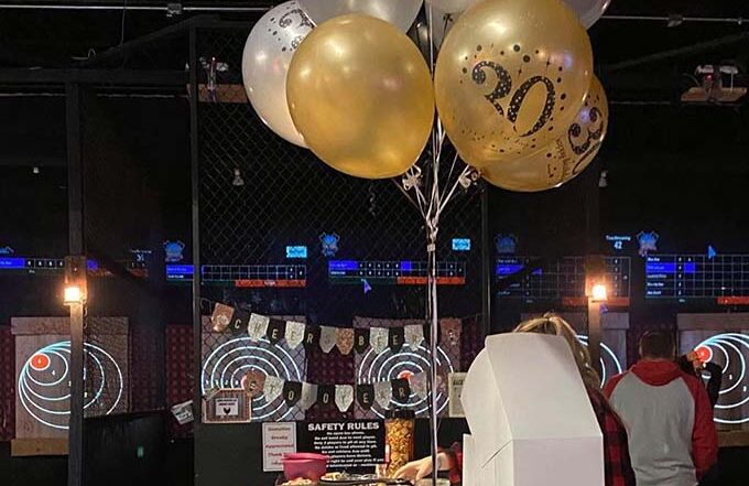 Birthday balloons and pizza boxes at Montana Nights.
