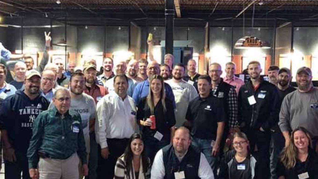 Large group gathering for a corporate axe-throwing event at Montana Nights.
