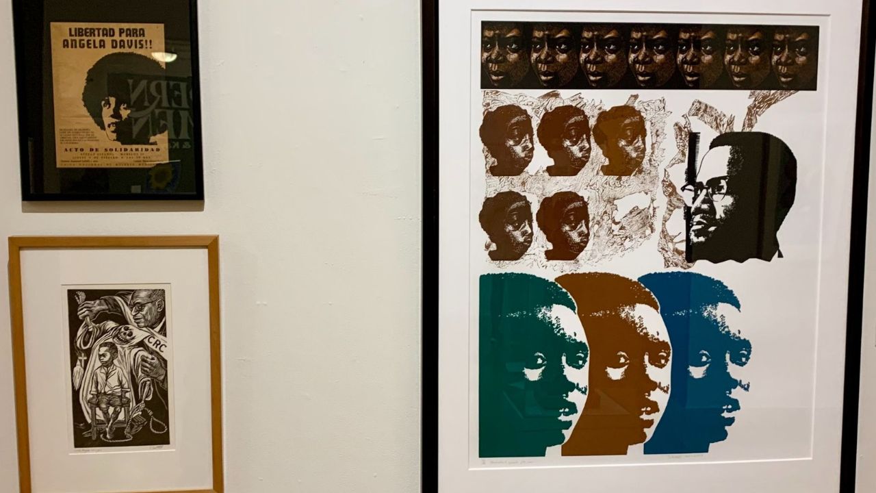 Framed cultural and historical artwork displayed inside a Bristol museum